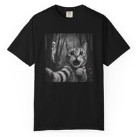 Load image into Gallery viewer, Black Halloween cat T-shirt featuring a scared cat taking a selfie in a spooky forest with a ghost hiding behind him.