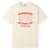 Load image into Gallery viewer, Beige t-shirt with red text and graphics on a white background