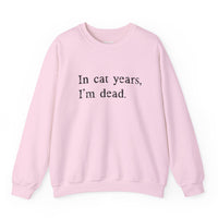 Load image into Gallery viewer, Light pink crewneck sweatshirt with black text reading In Cat Years, I’m Dead.