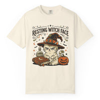Load image into Gallery viewer, Cream Comfort Colors Halloween cat T-shirt featuring a grumpy cat in a witch hat with a potion, spell book and pumpkin beneath the words “Resting Witch Face.”
