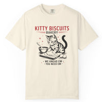 Load image into Gallery viewer, Beige t-shirt with a cat-themed graphic and text on a white background