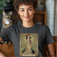 Load image into Gallery viewer, Woman wearing a t-shirt with &#39;The Cat Lady&#39; design, sitting on a couch with a cat in the background.
